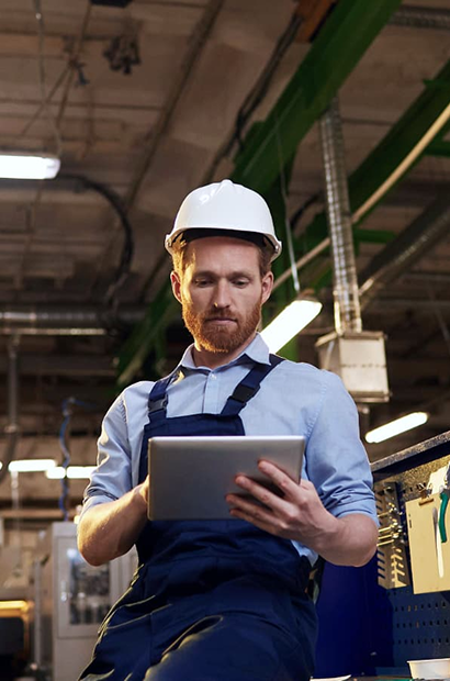 Manufacturing professional reviewing production data